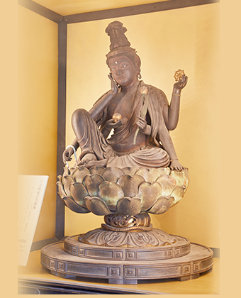The wooden statue of Nyoirin Kannon (Bodhisattva of Compassion) 
